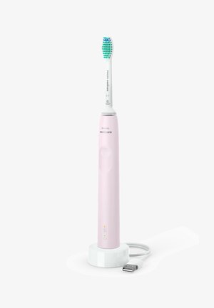 Spazzolino elettrico Philips Sonicare di colore rosa con testina bianca. Presenta un pulsante di accensione, luci indicatrici e una base di ricarica con cavo USB.