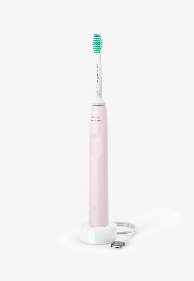 Spazzolino elettrico Philips Sonicare di colore rosa con testina bianca. Presenta un pulsante di accensione, luci indicatrici e una base di ricarica con cavo USB.