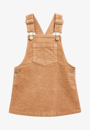Robe salopette en velours côtelé brun clair avec poche devant, bretelles réglables et boutons latéraux pour la fermeture.