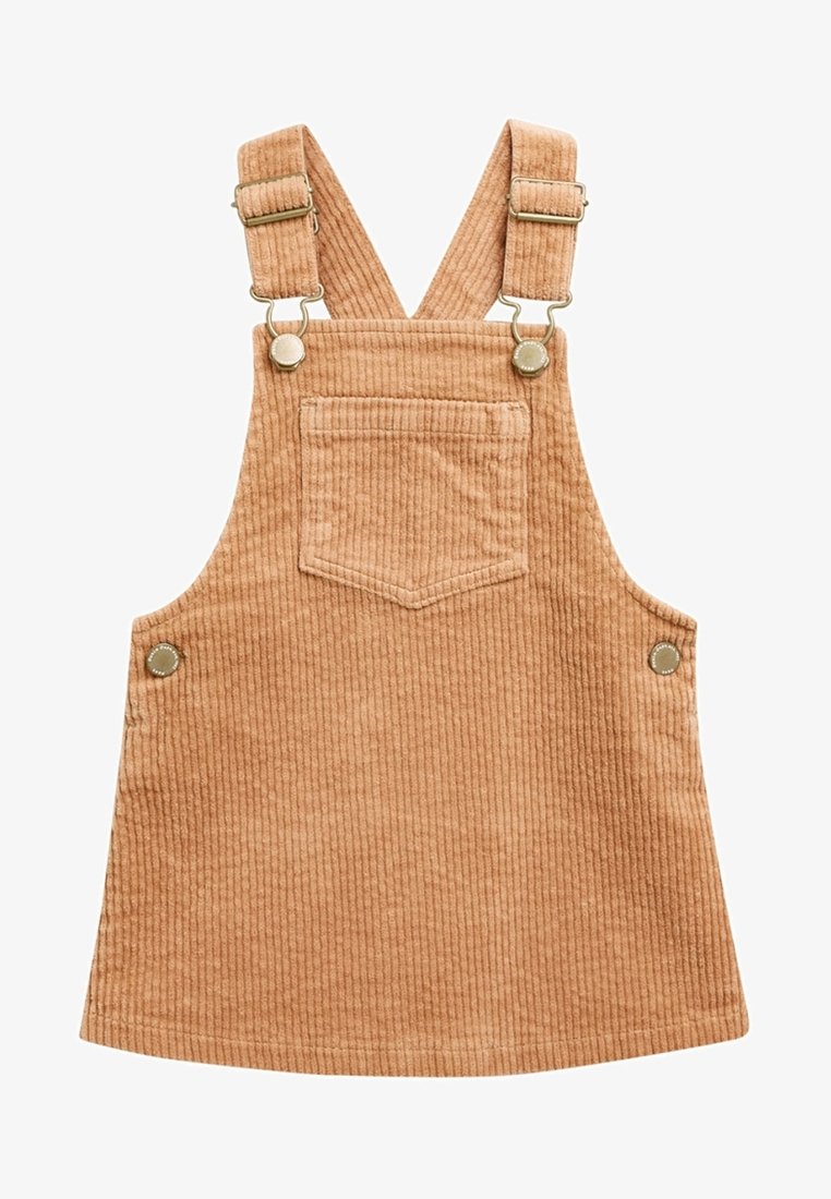 Robe salopette en velours côtelé brun clair avec poche devant, bretelles réglables et boutons latéraux pour la fermeture.