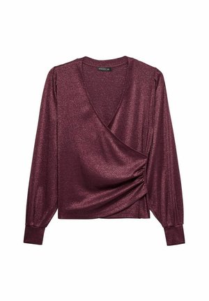 Haut enveloppant bourgogne en tissu métallisé. Dispose de longues manches bouffantes et d'un détail de ruché sur le côté. Le décolleté en V ajoute de l'élégance.