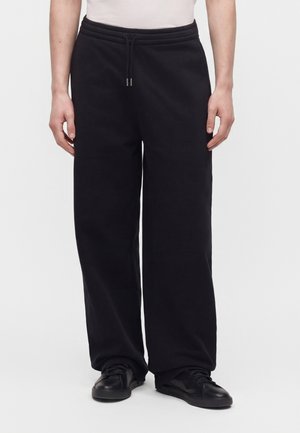 Han Kjøbenhavn, EMBOSSED DIAMOND - Долнище на анцуг - faded black