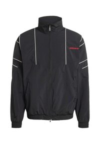 Black Adidas windbreaker jacket with tall collar, front zipper, white accent stripes, elastic cuffs, and two side pockets. Red logo on chest.