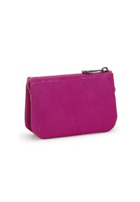 Pouch in nylon rosa con chiusura a zip, caratterizzato da una texture liscia e angoli arrotondati. Design compatto con dettagli di cucitura visibili.
