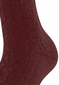 Bordeaux gebreide sok met ribbeltextuur, verstevigde hiel en gladde teen. Biedt een snug fit met een zachte, warme stof.