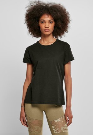 T-shirt corto nero in cotone con scollo rotondo, vestibilità comoda e texture liscia, abbinato a leggings con dettagli in pizzo.