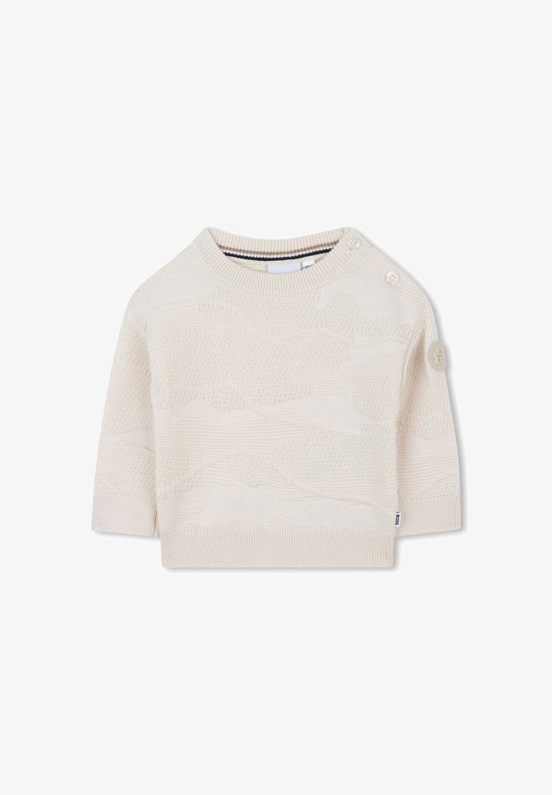 Maglione corto in avorio a maglia, con maniche corte, motivo testurizzato, scollatura rotonda e due bottoni sulla spalla sinistra.