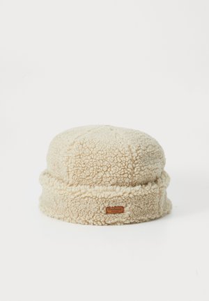 Cream-colored fleece bucket hat with a soft, textured finish, featuring a folded brim and a small branded leather patch.