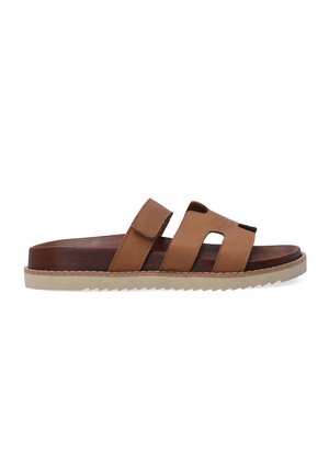 Brown leather slide sandals with two adjustable straps and open toe. Textured sole with a light-colored, zigzag pattern for grip.