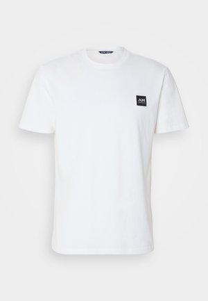 Witte katoenen t-shirt, ronde hals, korte mouwen. Kenmerkt zich door een klein zwart vierkant logo op de linkerkant van de borst. Eenvoudig en klassiek ontwerp.