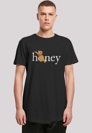 Black t-shirt featuring a cartoon bear and the word "honey" in white, relaxed fit, short sleeves, smooth cotton fabric.