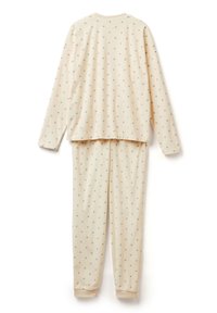 Lichtbeige pyjamapakket van zachte stof, met een gestippeld patroon in het grijs. De bovenkant heeft lange mouwen en een ronde halslijn; de broek is lang.