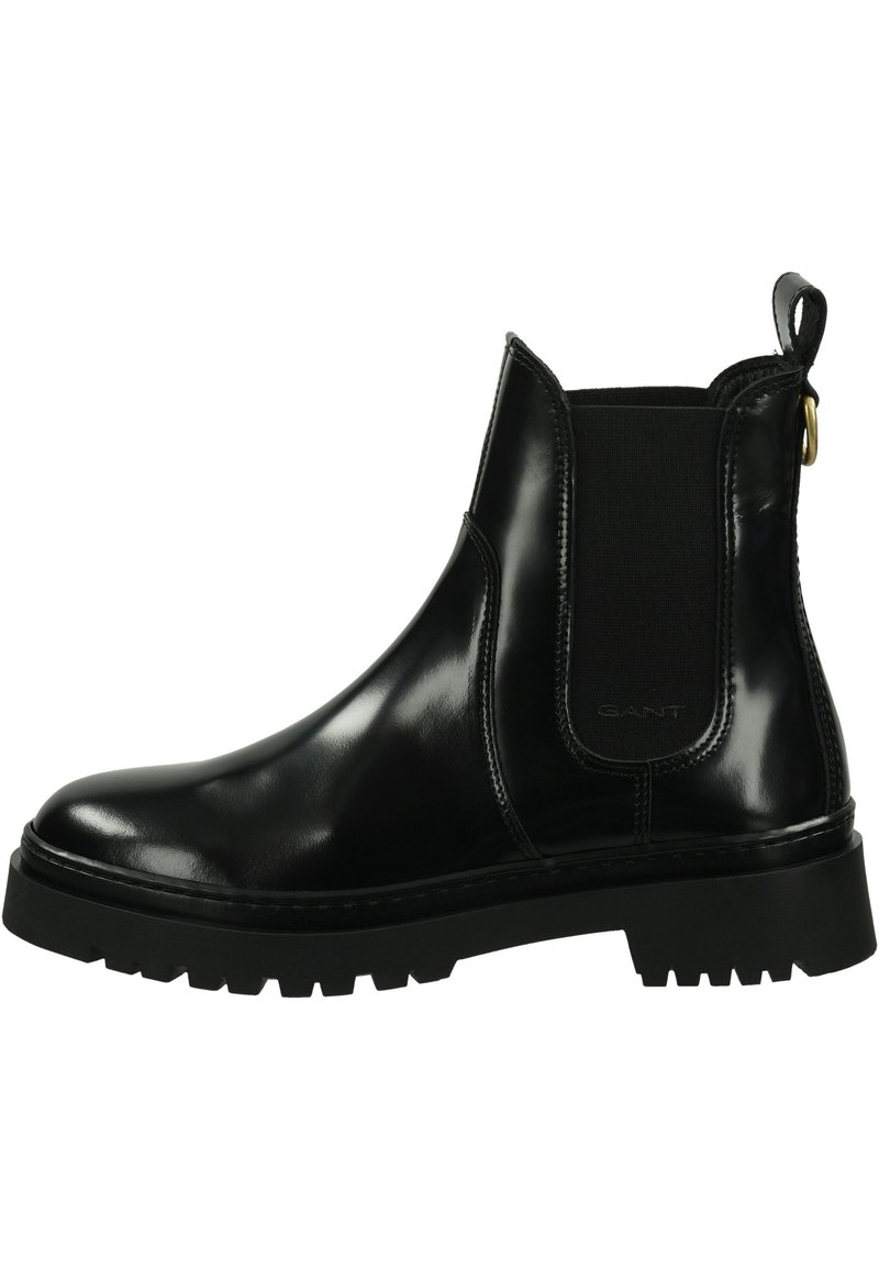 Black leather Chelsea boots with elastic side panels, contrasting rubber sole, and pull tab. Features smooth, shiny texture and sturdy design.