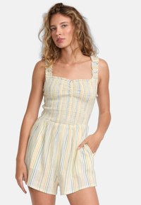 Stribet jumpsuit i blødt stof, med en tætsiddende bodice, flæser på stropperne, firkantet udskæring og sidelommer, i pastelfarver.