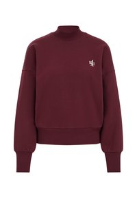 Felpa bordeaux con scollatura alta, spalle scese, polsini a coste e un piccolo logo ricamato sul petto. Tessuto morbido.