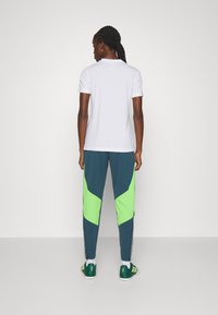 adidas Performance TIRO 23 COMPETITION - Trainingsbroek - arctic night/semi lucid lime