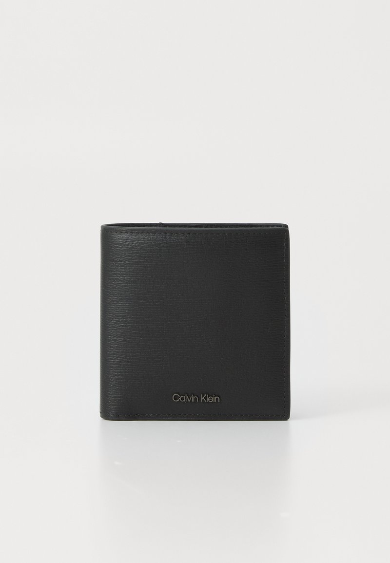 Black leather wallet with textured finish, bi-fold design, embossed brand logo on the front, and stitching accents. Compact and rectangular shape.