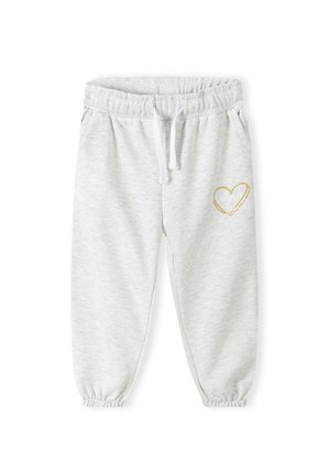 Sweatpants gris en tissu doux, dotés d'une taille élastique avec cordon de serrage, de chevilles resserrées et d'un motif en cœur doré sur la jambe gauche.