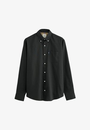 Black long-sleeve button-up shirt made of cotton, featuring a button-down collar, front pocket, and white buttons. Smooth texture.