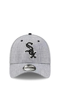 Gray baseball cap made of textured fabric featuring an embroidered black White Sox logo. Adjustable strap at the back.
