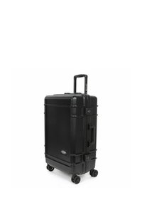 Black hard-shell suitcase with a rectangular shape, equipped with a retractable handle, four wheels, and combination lock for security.