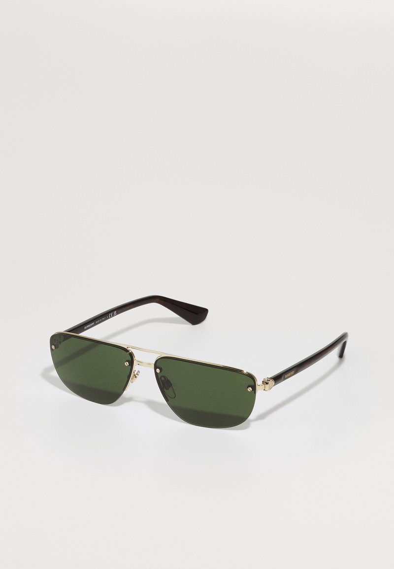 Óculos de sol com armação de metal, lentes verdes, design angular, detalhes em dourado e hastes em castanho-escuro. Sem padrões visíveis.