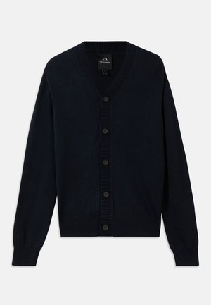 Navy blue cardigan made of fine knit fabric, featuring a V-neckline, seven buttons down the front, and ribbed cuffs and hem.