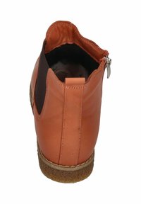 Leder-Stiefelette in Orange, mit Reißverschluss, elastischer Seitenpartie und strukturiertem Gummisohle. Glatte Oberfläche mit kontrastierenden Akzenten.
