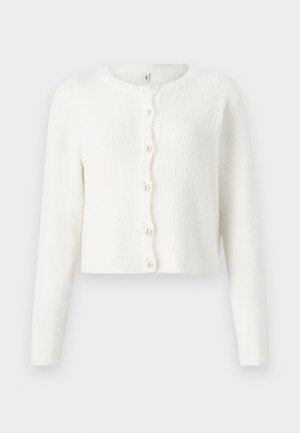 White cardigan made from soft, textured fabric. Features a round neckline, long sleeves, and six pearl-like buttons down the front.