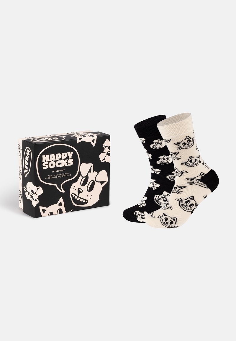 Schwarz-weiße Socken mit Katzen- und Hundemotiven, aus weichem Stoff gefertigt. Verpackt in einer dekorativen schwarzen Box mit verspielten Grafiken.