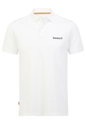 Polo en coton blanc à manches courtes, patte de boutonnage à trois boutons, logo Timberland en gris foncé sur la poitrine gauche, et col contrastant en accent.