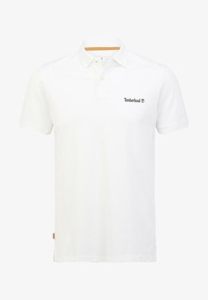 White cotton polo shirt with short sleeves, three-button placket, Timberland logo in dark gray on left chest, and a contrast collar accent.