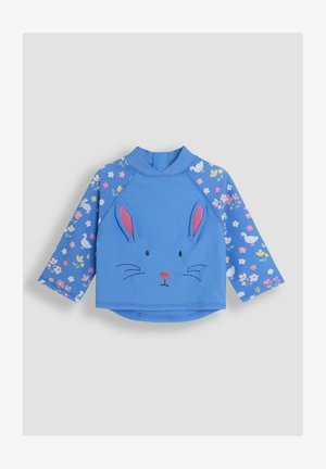 Sinine pika varrukaga pluus, millel on jänese näo disain, tikitud vuntsidega, roosade kõrvadega ja lillemustritega varrukatega. Valmistatud pehmest kangast.