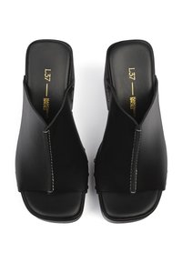 Black leather open-toe sandals with a split design, featuring a smooth texture, flat sole, and subtle stitching detail on the upper.