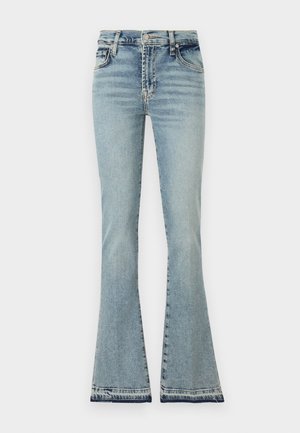 Blande lys blå denimjeans med høyt liv, definerte sømmer og frynsete kant. Materialet ser mykt ut med et klassisk fem-lommesdesign.