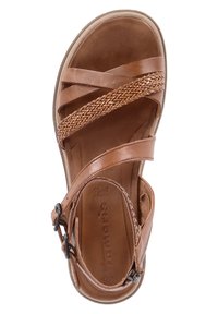 Ruske nahkate sandaalit ristikkäisillä hihnoilla, kudottu koriste, pehmustettu pohja ja säätösolki turvallista istuvuutta varten. Littee pohja.