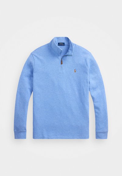 Sweatshirt azul claro com fecho de quarto, punhos canelados e logótipo bordado. Feito de tecido texturado, apresenta um colarinho de pé.
