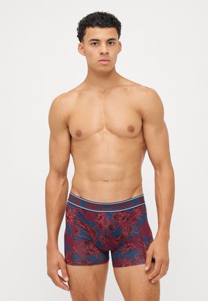 Boxer-briefs avec un motif floral rouge foncé et bleu, une taille élastique avec logo et une coupe ajustée. Fabriqués en tissu doux.