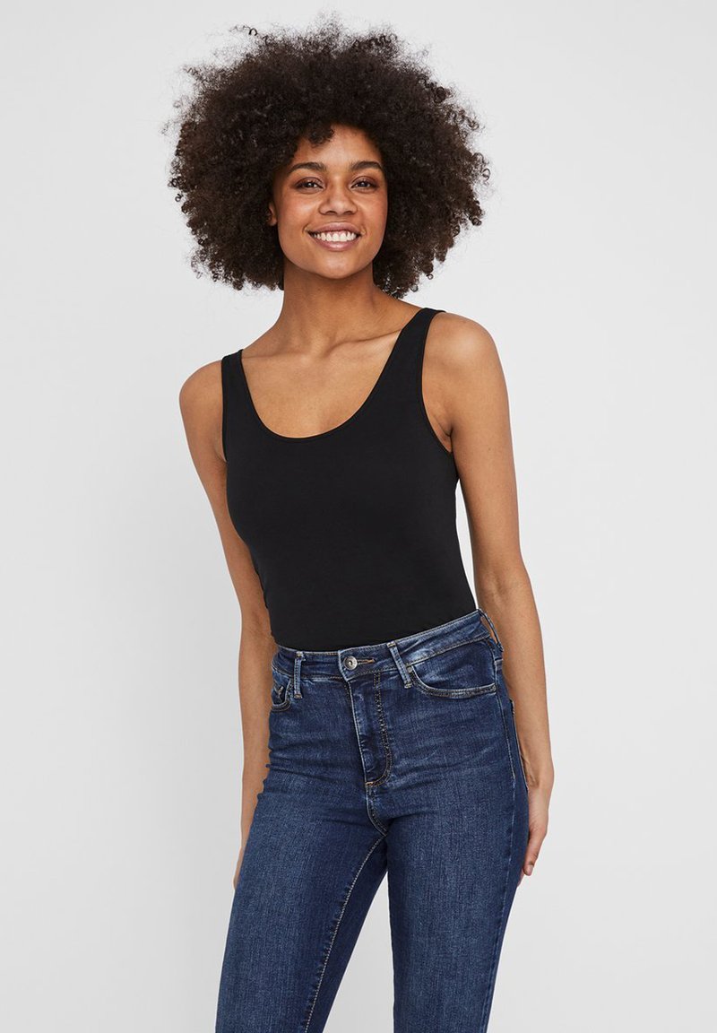 Black sleeveless bodysuit with a rounded neckline, paired with dark blue denim jeans. Smooth fabric with a fitted design and minimal detail.