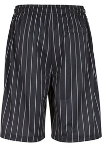 Shorts de bain noirs avec des rayures blanches verticales, taille élastique et poche arrière. Fabriqués en matériau léger et à séchage rapide.