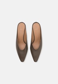 Brown leather mules with a pointed toe and open back, featuring a smooth texture and minimalistic design. Logo embossed on the insole.