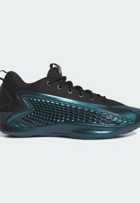 Black athletic shoes with a textured upper, a glossy teal accent, and a honeycomb-patterned design on the side. Circular laces and a pull tab.