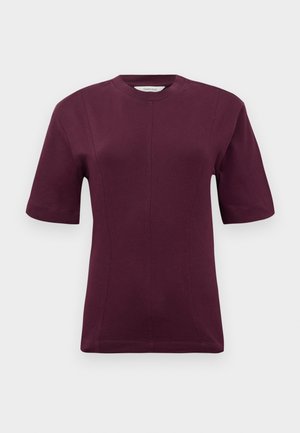 Short-sleeved maroon t-shirt made from smooth cotton fabric, featuring a round neckline and subtle seam detailing on the front.