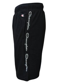 Pantaloni sportivi neri realizzati in un tessuto morbido con vita elastica. Presentano un logo bianco e del testo sulla cucitura laterale.