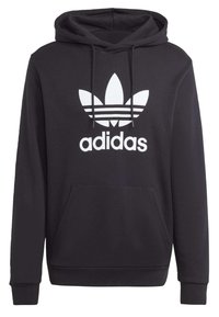 Felpa nera con cappuccio realizzata in cotone, caratterizzata da un grande logo Adidas bianco con tre strisce orizzontali e una tasca a marsupio frontale.