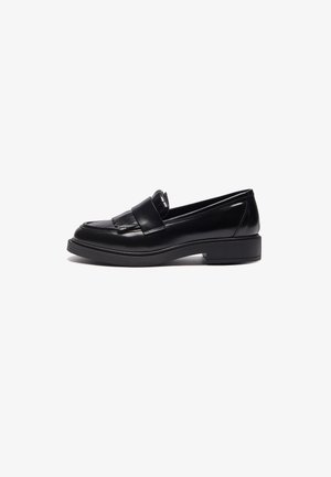 Black leather loafers with a sleek design, featuring a rounded toe, decorative fringe, and a low, textured rubber sole.