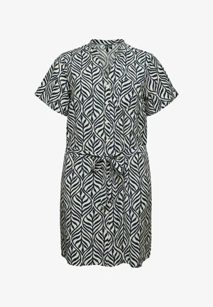 Rövid ujjú, gombos ruha fekete-fehér levélmintával, elöl megkötős derékkal és mellzsebes díszítéssel.