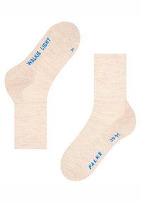 Meias bege com uma textura suave, punhos canelados e texto azul nas laterais com as inscrições "WALKIE LIGHT" e "FALKE". Meia direita marcada com "R".