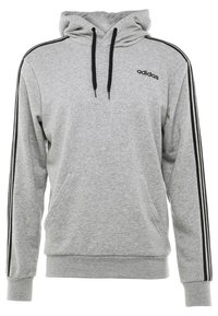 Felpa grigia realizzata in misto cotone, con tasca frontale, cappuccio con cordino e strisce nere sui lati. Logo "Adidas" sul petto.