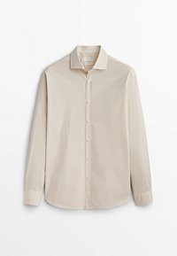 Chemise à manches longues à carreaux beige et crème avec un col boutonné, comprenant des boutons à l'avant et une texture lisse.